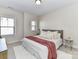 Inviting bedroom featuring a bed with neutral pillows and a pink throw at 15140 Rocky Bluff Loop, Davidson, NC 28036