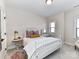 Cozy bedroom featuring a white iron bed frame and neutral decor at 15140 Rocky Bluff Loop, Davidson, NC 28036