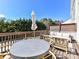 Outdoor deck area with table, chairs, and seating, ideal for relaxing at 15140 Rocky Bluff Loop, Davidson, NC 28036