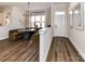Stylish dining area featuring a unique round table with booth seating and modern lighting at 15140 Rocky Bluff Loop, Davidson, NC 28036