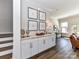 Entryway features beautiful cabinetry with light wood countertop, decor, and modern finishes at 15140 Rocky Bluff Loop, Davidson, NC 28036