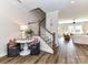 Welcoming foyer with hardwood floors, staircase, and tasteful decor at 15140 Rocky Bluff Loop, Davidson, NC 28036