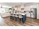 Open kitchen featuring a large island with bar seating and modern stainless steel appliances at 15140 Rocky Bluff Loop, Davidson, NC 28036