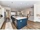 Modern kitchen island with seating and stainless steel dishwasher with an open concept floorplan at 15140 Rocky Bluff Loop, Davidson, NC 28036