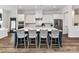 Spacious kitchen with an island, white cabinetry, and stainless steel appliances at 15140 Rocky Bluff Loop, Davidson, NC 28036