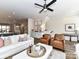 Open-concept living room features hardwood floors, ample natural light, and a staircase at 15140 Rocky Bluff Loop, Davidson, NC 28036
