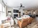 Inviting living room with fireplace flowing into a bright kitchen and open floor plan at 15140 Rocky Bluff Loop, Davidson, NC 28036
