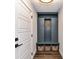 Mudroom with custom built-in storage, bench, woven baskets, and modern finishes at 15140 Rocky Bluff Loop, Davidson, NC 28036