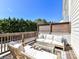 Inviting outdoor patio featuring stylish seating, wooden accents and privacy fencing at 15140 Rocky Bluff Loop, Davidson, NC 28036