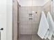 Close up of a modern shower with tiled walls and glass enclosure at 15140 Rocky Bluff Loop, Davidson, NC 28036