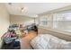 Unfinished basement with carpeted floors and windows providing natural light, offering potential for customization at 1740 12Th Street Nw Dr, Hickory, NC 28601
