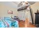 Bedroom with a unique loft bed, offering additional space and style, along with hardwood floors and natural light at 1740 12Th Street Nw Dr, Hickory, NC 28601
