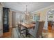 Formal dining room featuring a large table, chandelier, and ample natural light at 1740 12Th Street Nw Dr, Hickory, NC 28601