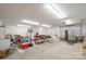 An oversized garage with fluorescent lighting, storage, and garage doors at 1740 12Th Street Nw Dr, Hickory, NC 28601