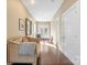 Bright hallway with hardwood floors, a sitting bench, and a view of the backyard through glass doors at 1740 12Th Street Nw Dr, Hickory, NC 28601