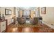 Charming living room with hardwood floors, a classic rug, and comfortable seating with natural light at 1740 12Th Street Nw Dr, Hickory, NC 28601