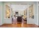 Open-concept living room with hardwood floors, classic pillars, fireplace, and lots of natural light at 1740 12Th Street Nw Dr, Hickory, NC 28601