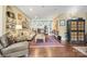 Cozy living room with hardwood floors, vintage furniture, and unique wall decor at 1740 12Th Street Nw Dr, Hickory, NC 28601