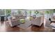 A living room featuring hardwood floors, neutral paint, and ample natural light at 1740 12Th Street Nw Dr, Hickory, NC 28601