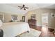 A beautifully decorated main bedroom with a ceiling fan, and hardwood floors at 1740 12Th Street Nw Dr, Hickory, NC 28601