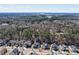 View of home and neighborhood, featuring a wooded backdrop and lake in the distance at 17609 Caddy Ct, Charlotte, NC 28278