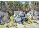 A stunning view of this home with a gray roof, attached garage, and manicured lawn at 17609 Caddy Ct, Charlotte, NC 28278