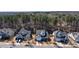 Overhead view of home in a neighborhood with a two car garage, lawn and mature trees at 17609 Caddy Ct, Charlotte, NC 28278