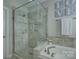 Modern bathroom showcasing a glass shower with stylish tile, a soaking tub, and neutral decor at 17609 Caddy Ct, Charlotte, NC 28278