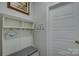 Inviting entryway with a storage bench, hooks, and beach-themed decor, setting a welcoming tone at 17609 Caddy Ct, Charlotte, NC 28278