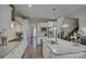 Spacious kitchen with white cabinets, stainless steel appliances, island, and hardwood floors at 17609 Caddy Ct, Charlotte, NC 28278