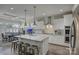 Modern kitchen with a spacious island, stainless steel appliances, and white cabinetry with an open concept at 17609 Caddy Ct, Charlotte, NC 28278