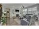 Bright living room featuring hardwood floors, a fireplace with built-ins, and comfortable gray leather seating at 17609 Caddy Ct, Charlotte, NC 28278