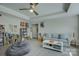 Cozy living room with comfortable seating, ample record storage, and a stylish coffee table, perfect for entertainment at 17609 Caddy Ct, Charlotte, NC 28278