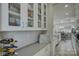 Well-organized pantry with glass-front cabinets and ample storage space, providing kitchen convenience at 17609 Caddy Ct, Charlotte, NC 28278