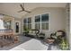 Covered porch with seating area, ceiling fan, and view of the yard at 17609 Caddy Ct, Charlotte, NC 28278