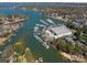 Aerial view highlighting waterfront homes, private docks, and a marina on the serene waters of Lake Norman at 19827 Henderson Rd # L, Cornelius, NC 28031