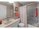 Well-lit bathroom featuring neutral decor, a vanity with storage, and a shower-tub combination at 19827 Henderson Rd # L, Cornelius, NC 28031