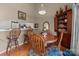 Inviting dining area with a wooden table, chairs, open to the kitchen area, and natural lighting at 19827 Henderson Rd # L, Cornelius, NC 28031