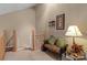 Neutral hallway with a bench, accent lamp, and access to upper level, creating a cozy and inviting transition space at 19827 Henderson Rd # L, Cornelius, NC 28031