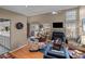 Bright living room featuring a fireplace, comfortable seating, and wood floors at 19827 Henderson Rd # L, Cornelius, NC 28031