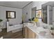 Elegant bathroom featuring double sinks, a soaking tub, and stylish decor for a luxurious feel at 2013 Vick Wilson Rd, Shelby, NC 28152