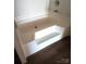 Bright, white bathtub with a step and modern fixtures, perfect for unwinding at 2013 Vick Wilson Rd, Shelby, NC 28152