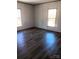 Bright bedroom with hardwood flooring and natural light streaming in through the windows at 2013 Vick Wilson Rd, Shelby, NC 28152