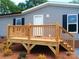 Close-up of the home's wooden front porch and siding, with the house number displayed at 2013 Vick Wilson Rd, Shelby, NC 28152