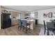 Charming kitchen featuring an island with seating, modern appliances, and wood-look flooring for a warm ambiance at 2013 Vick Wilson Rd, Shelby, NC 28152