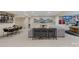 Spacious finished basement featuring a sitting area, dining table, and entertainment area at 208 Woodwinds Dr, Mount Holly, NC 28120