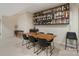Finished basement with a dining table, bar shelving, and seating at 208 Woodwinds Dr, Mount Holly, NC 28120