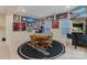 Finished basement game area with a round table, chairs, game machines, and custom decor at 208 Woodwinds Dr, Mount Holly, NC 28120