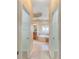 Hallway view of a spacious bathroom with a soaking tub and tile flooring at 208 Woodwinds Dr, Mount Holly, NC 28120