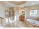 Luxurious bathroom with walk-in shower, soaking tub, and elegant vanity at 208 Woodwinds Dr, Mount Holly, NC 28120